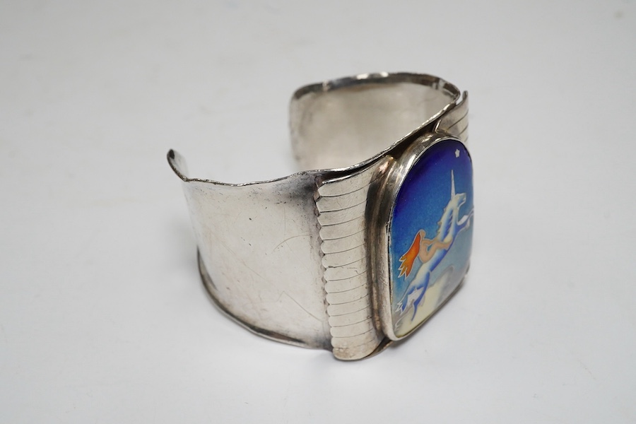 A modern Macy's of New York sterling and polychrome enamel 'Grain of Sand' bangle, gross 83 grams. Condition - poor to fair